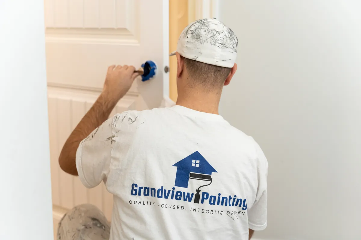Grandview painter finishing an interior door